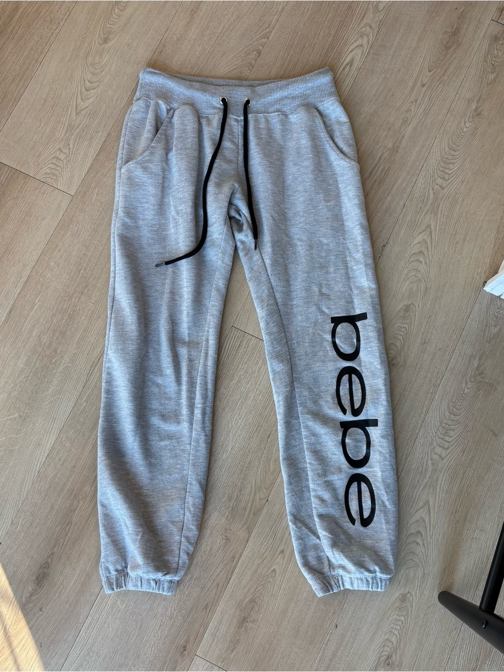 grey Bebe sweatpants with black accents